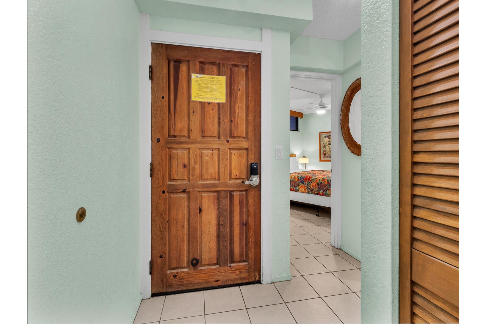 Step through your private entrance into a welcoming space with warm wood details and coastal charm that sets the perfect tone for your getaway.