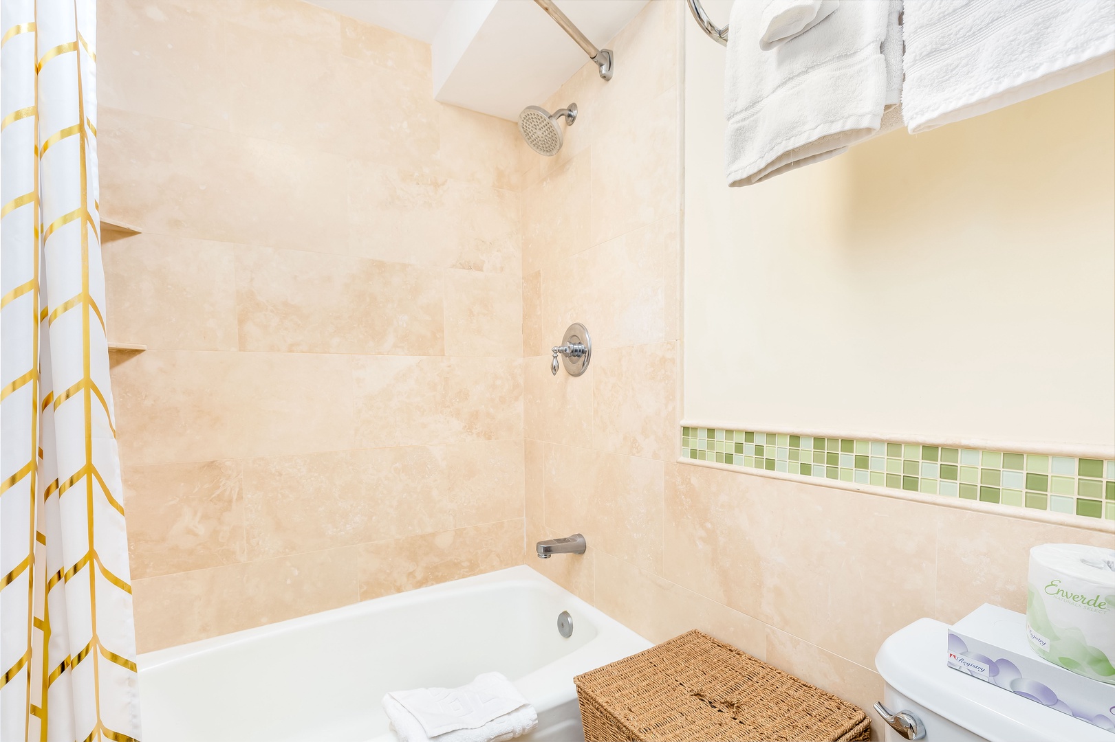 Unwind in your serene bathroom with warm stone tiling, a deep soaking tub, and a refreshing rainfall shower waiting for you after each day's adventure.