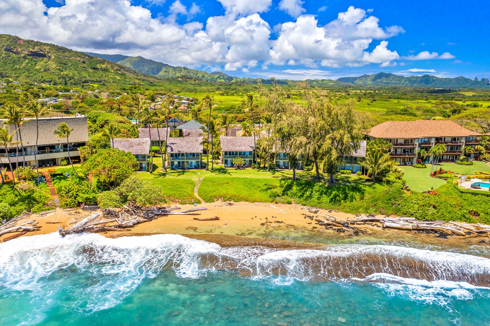 Stunning beachfront property nestled between mountains and pristine waters, offering the ultimate tropical escape.