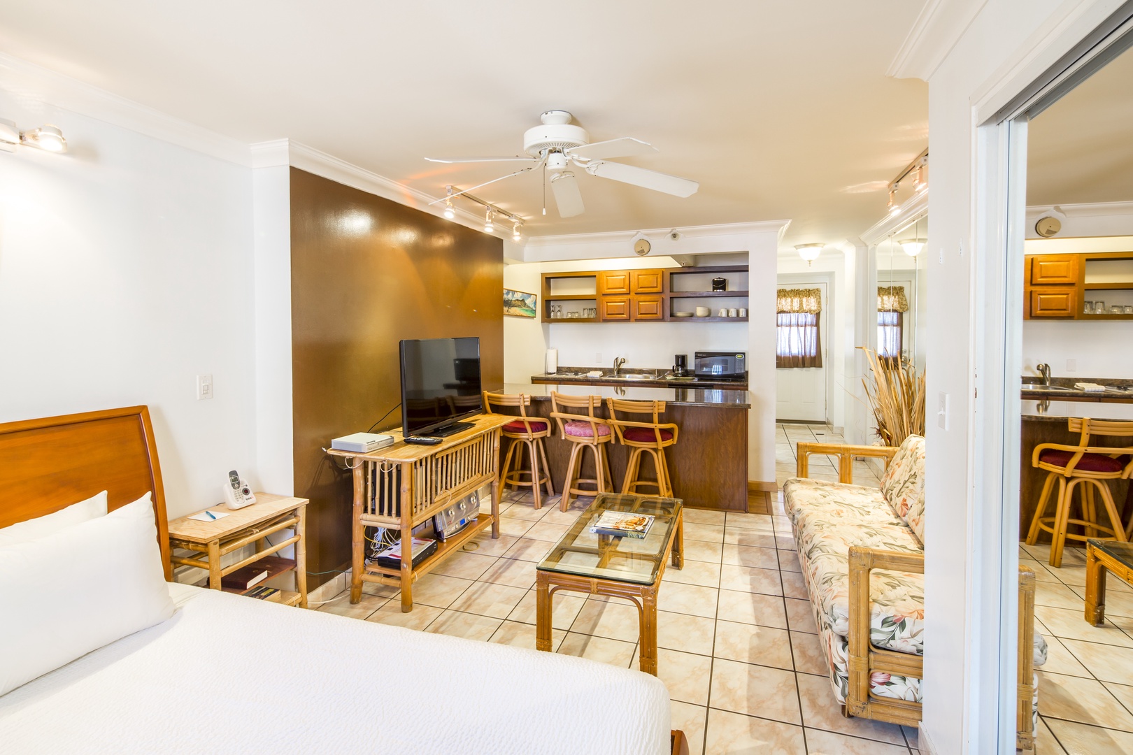 Your bright, open studio suite blends relaxed island style with thoughtful design—a cozy bed, sunny living space, and kitchen bar make this your perfect home base for unforgettable memories.