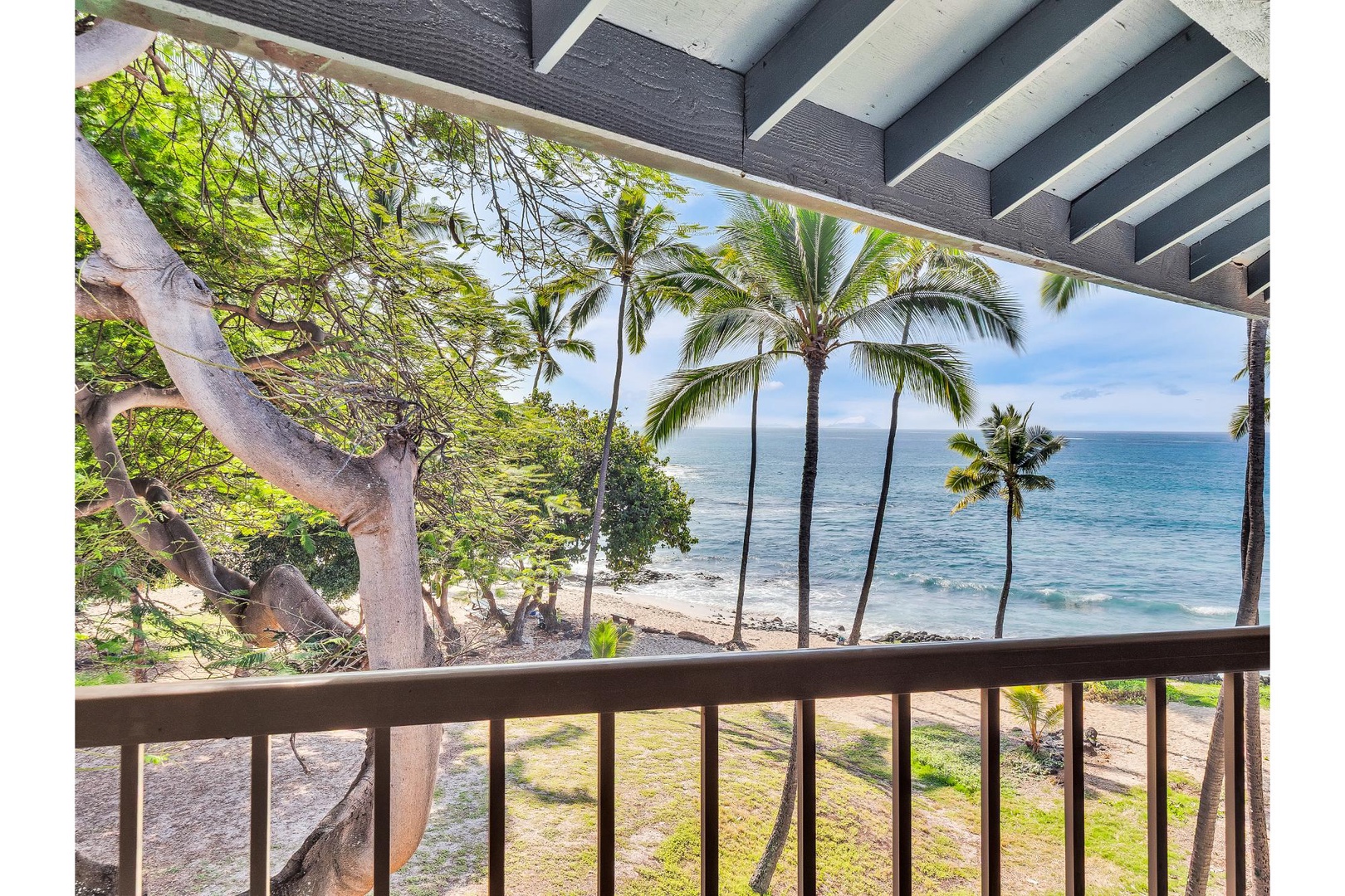 Step onto your private balcony and breathe in the ocean breeze as swaying palms frame pristine waters below.