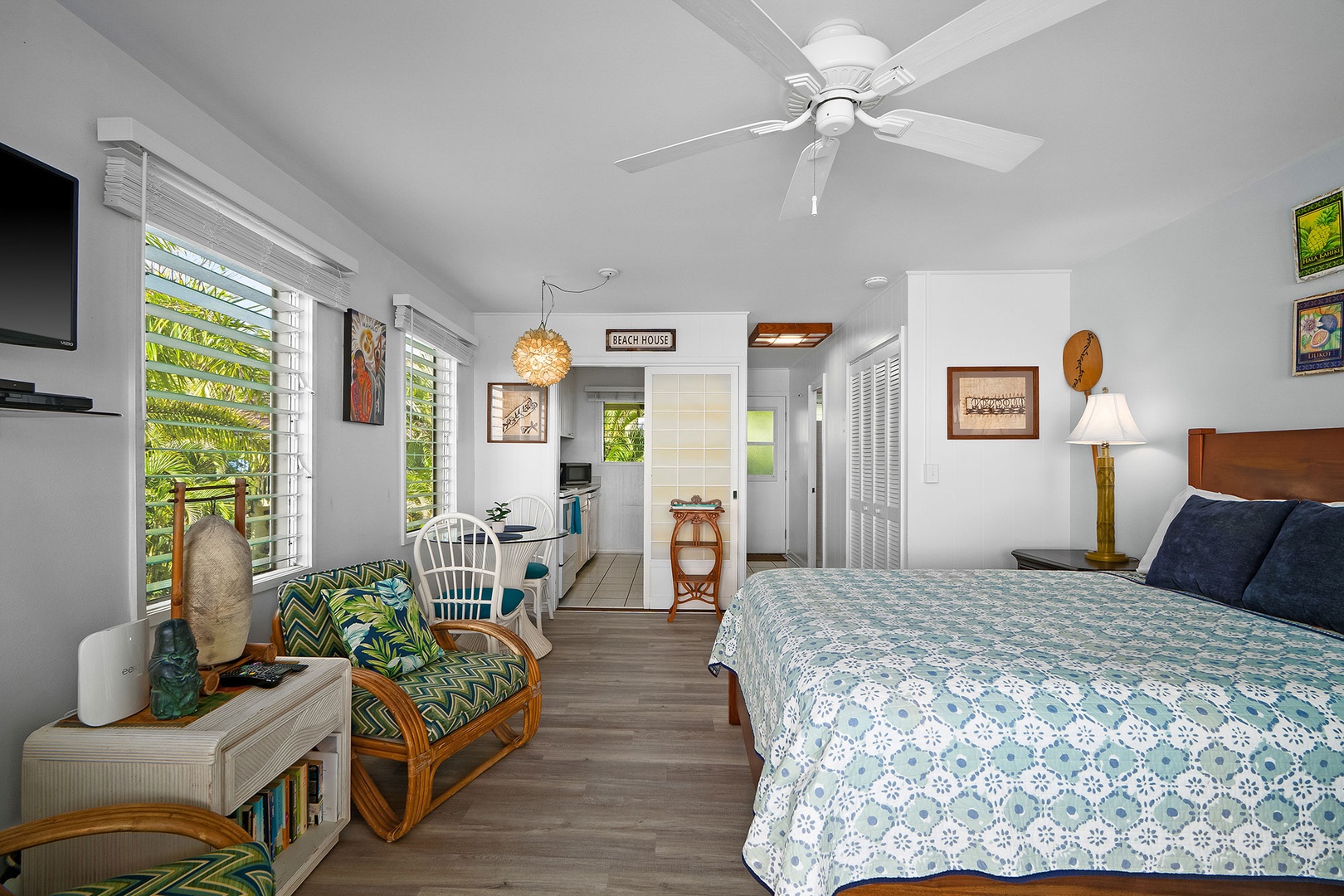 Unwind in your tropical studio with island breezes flowing through bright windows and cozy tropical decor creating your perfect beach retreat.