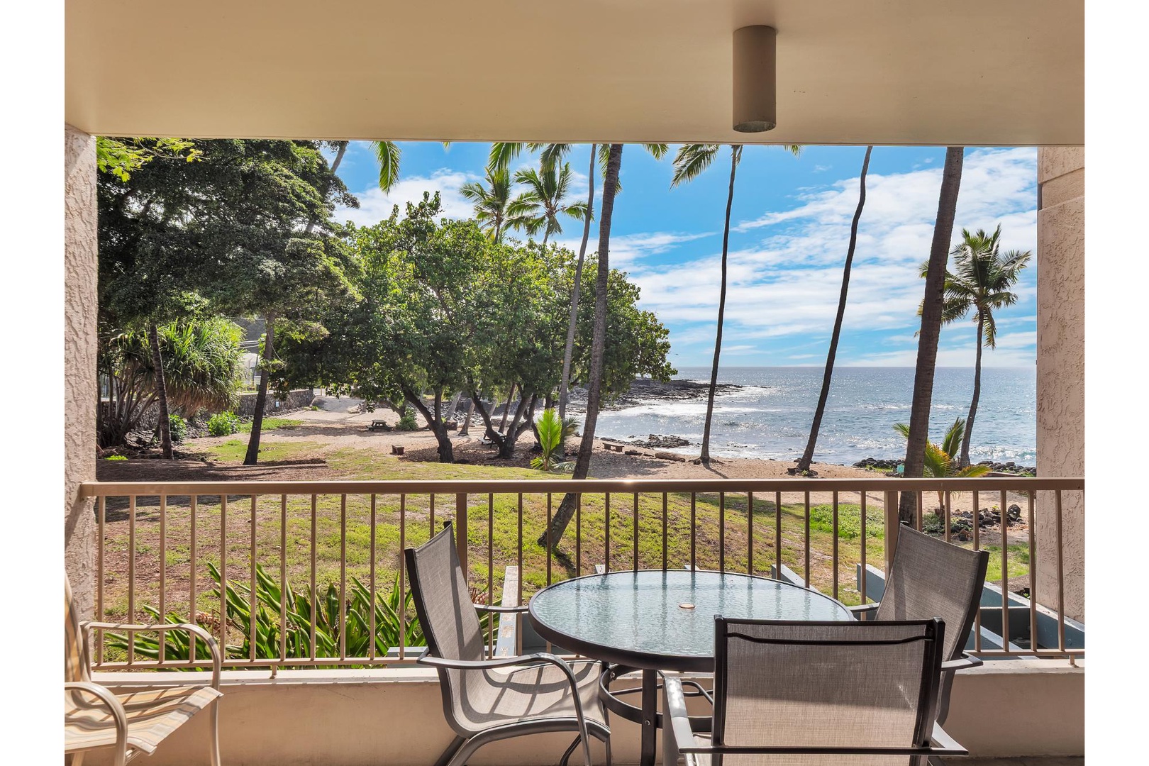 Step onto your private balcony and savor morning coffee while gazing at swaying palms and pristine coastline stretching endlessly before you.