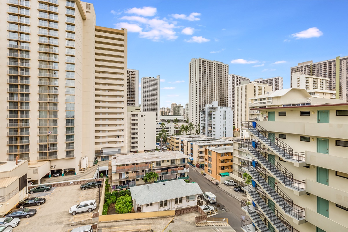 This rental is positioned within a vibrant urban neighborhood, surrounded by a diverse mix of mid-rise and high-rise buildings that define the city skyline.