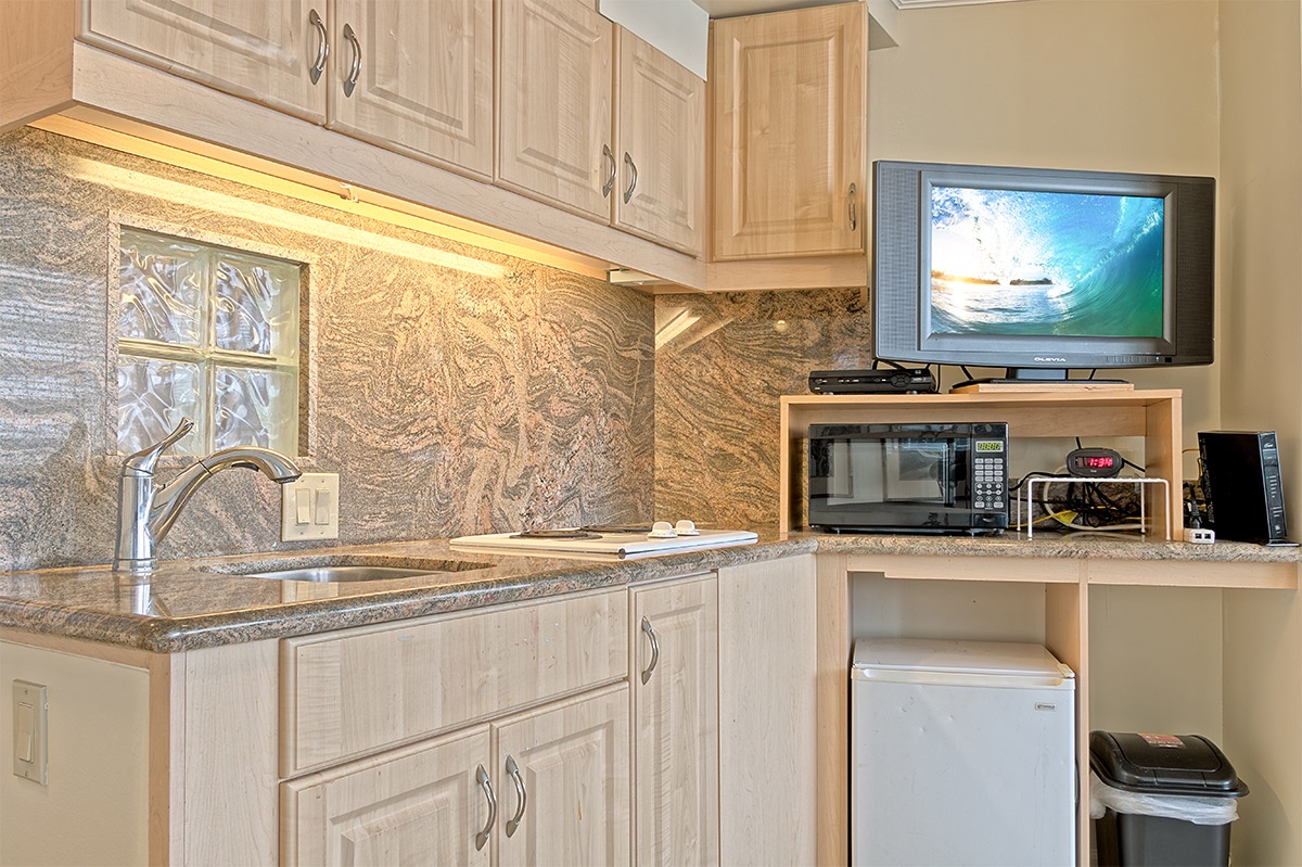 Your kitchenette has everything you need: microwave, mini-fridge, and a TV for entertainment while you prepare snacks or unwind after exploring.