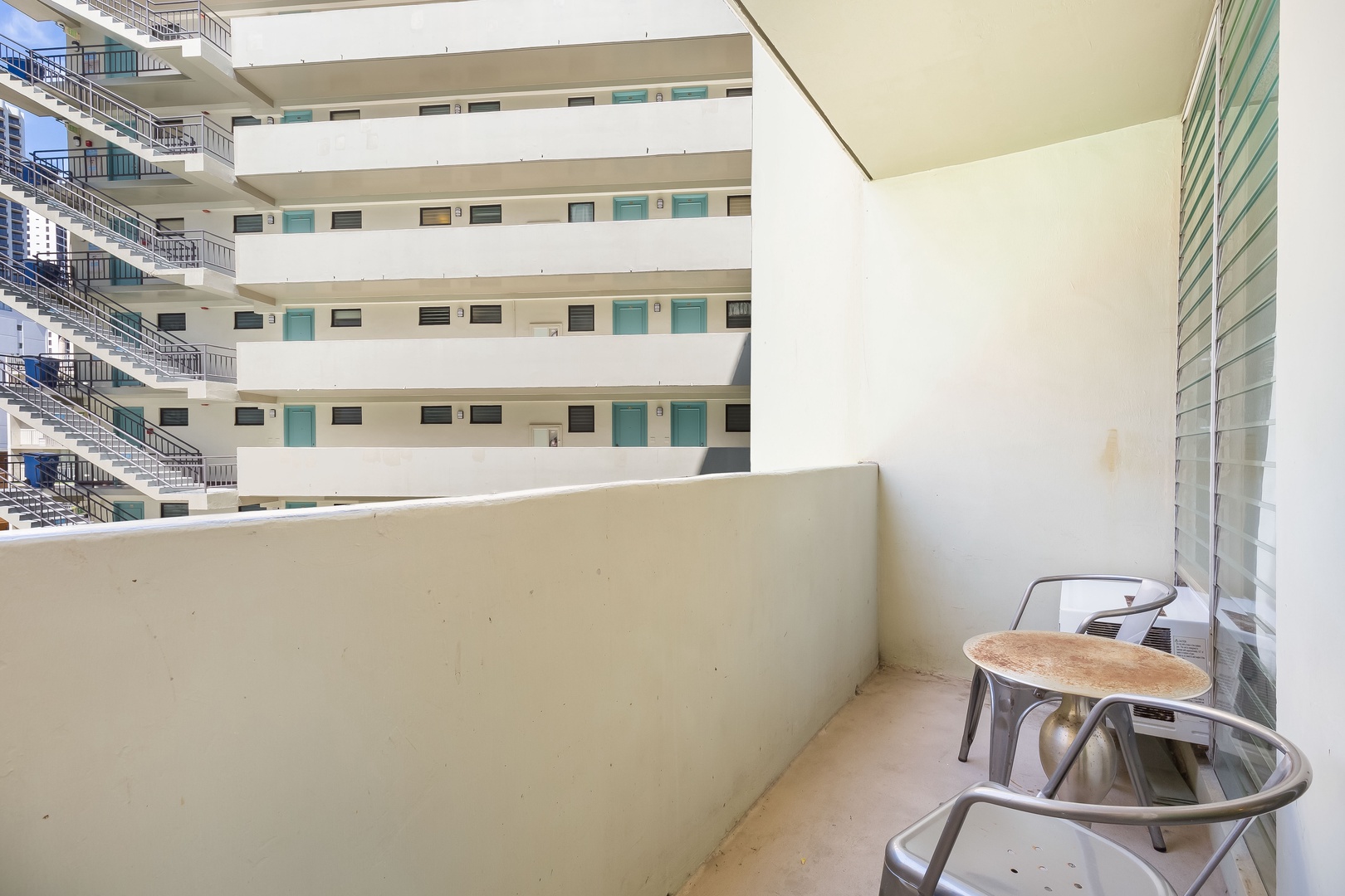 Your private balcony overlooks the inner courtyard, offering a peaceful spot to enjoy your morning coffee or unwind after a day exploring.