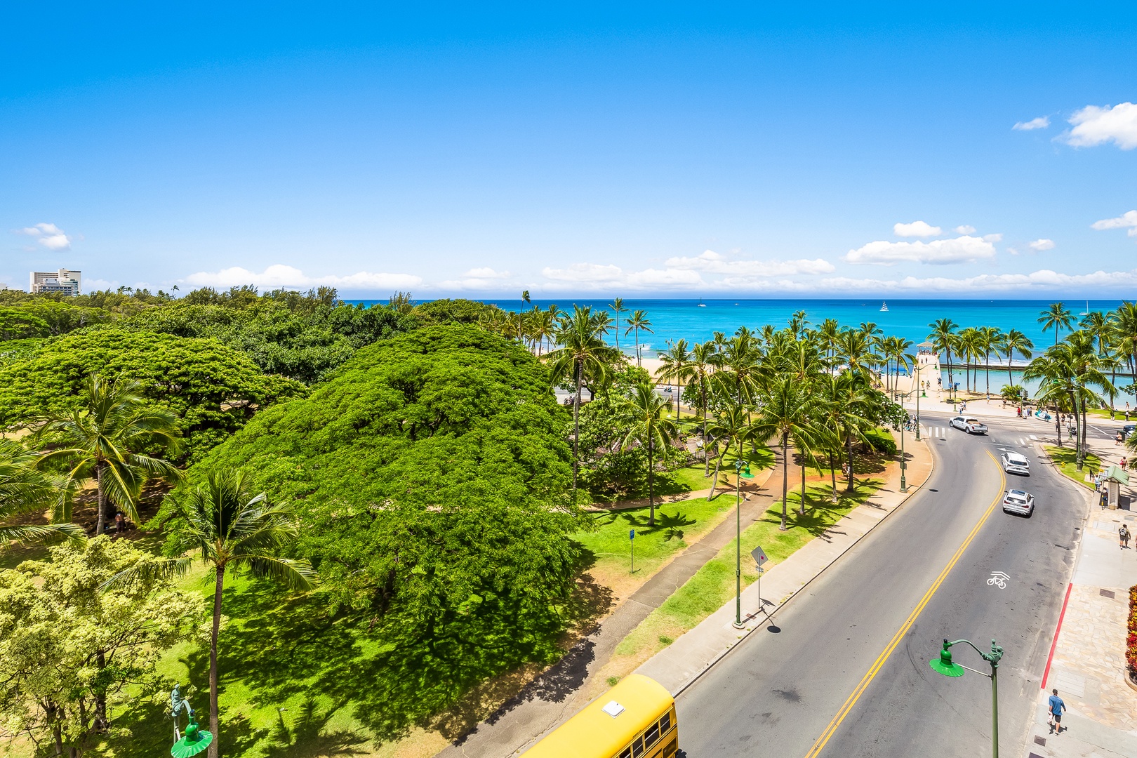 Aerial view of the property's beachfront location with turquoise waters, palm-lined streets, and easy access to tropical shores and local attractions.