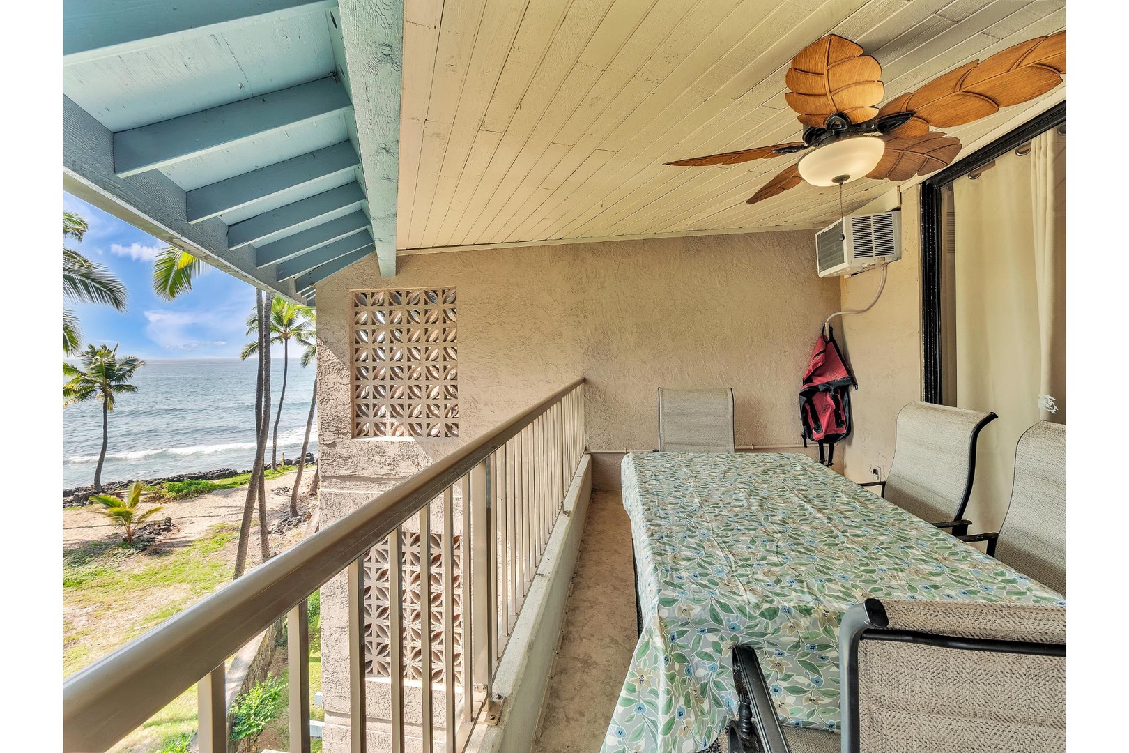 Drift off to tropical dreams on your oceanfront balcony, where palm trees sway and waves whisper just steps away.