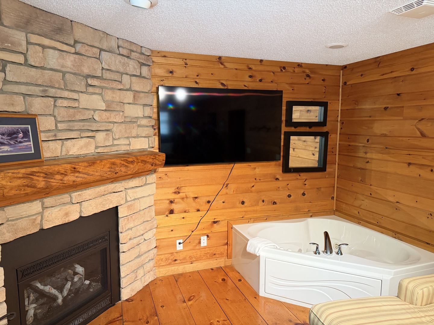 Picture yourself unwinding in your own private spa with a crackling fire, soaking in a jetted tub while streaming your favorite shows on the flat-screen TV above the rustic stone fireplace.