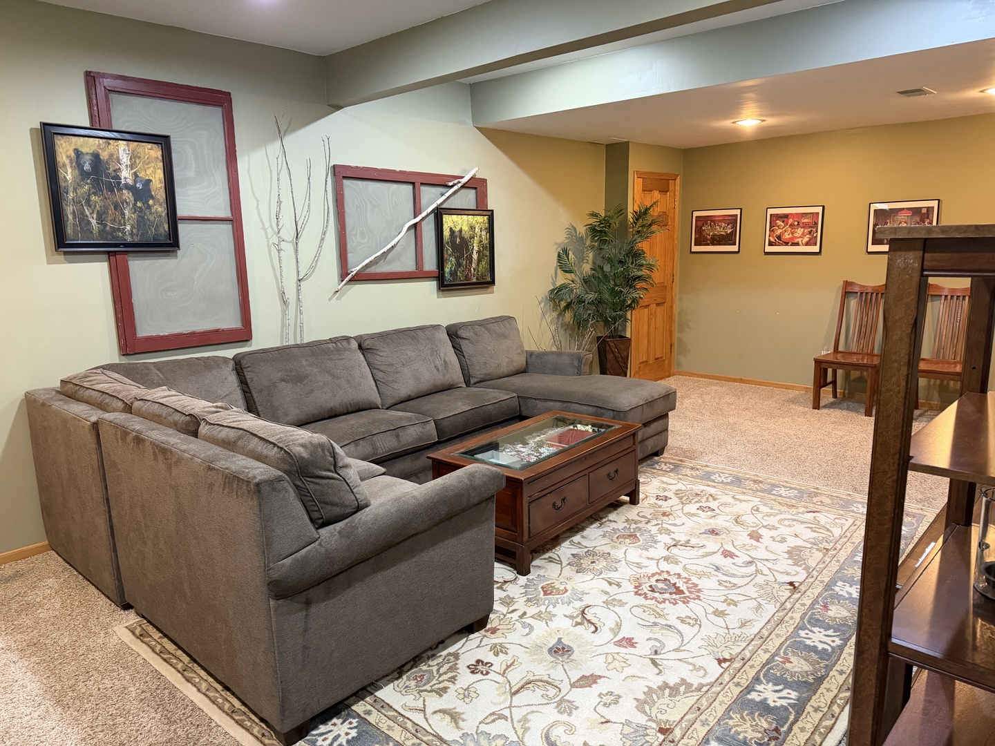 Unwind in your private living area, featuring a spacious sectional sofa and tasteful décor—perfect for relaxing after exploring the area.