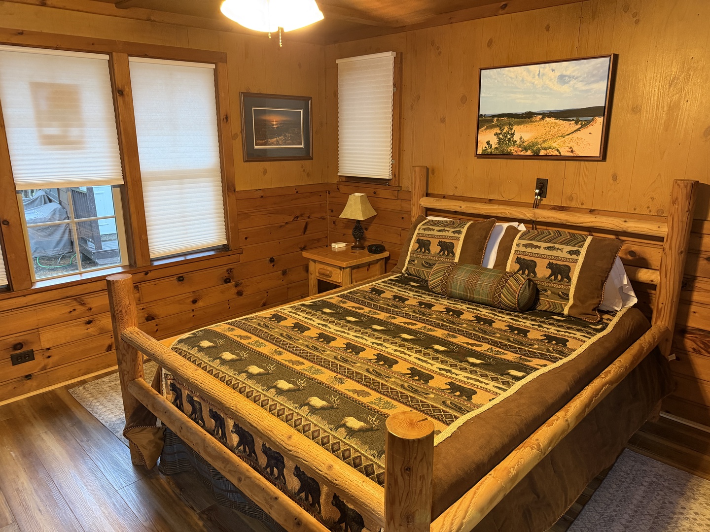 Unwind in your cozy cabin bedroom with rustic log furnishings, warm wood paneling, and nature-inspired décor that brings the outdoors in for your mountain retreat.