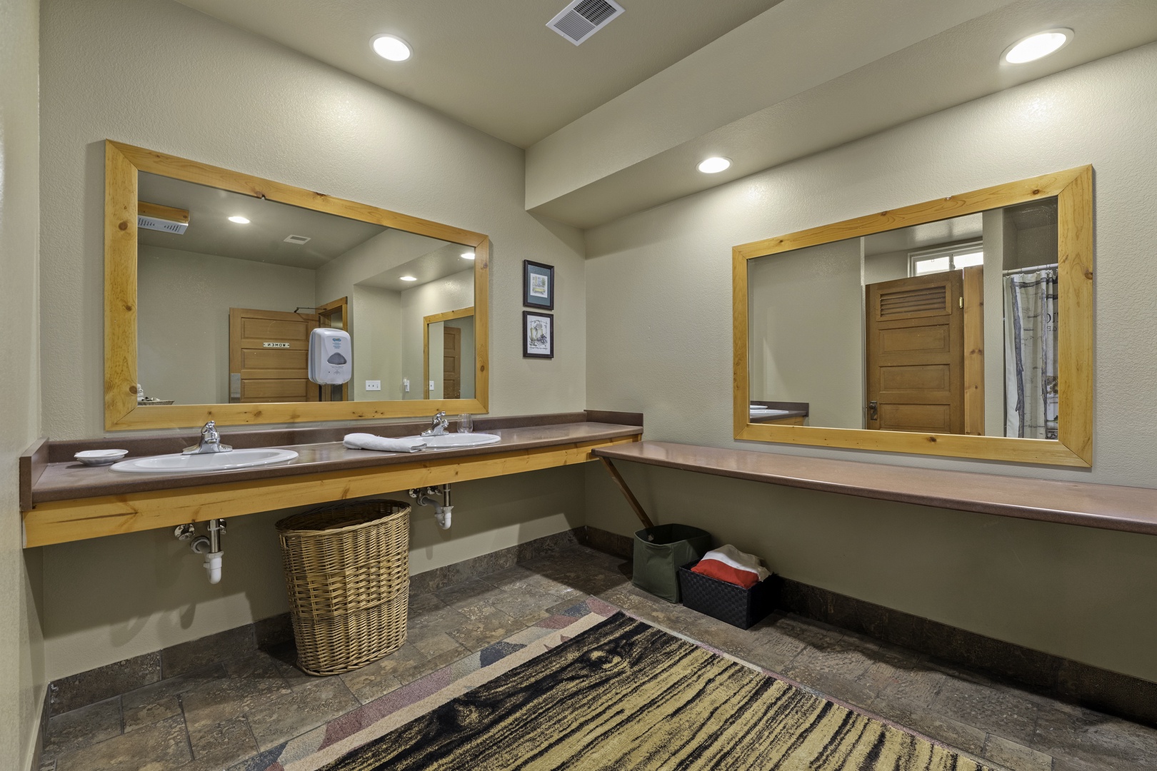 Dual vanities with wood-framed mirrors and ample counter space offer you a comfortable, well-lit place to start your day feeling refreshed and ready for adventure.