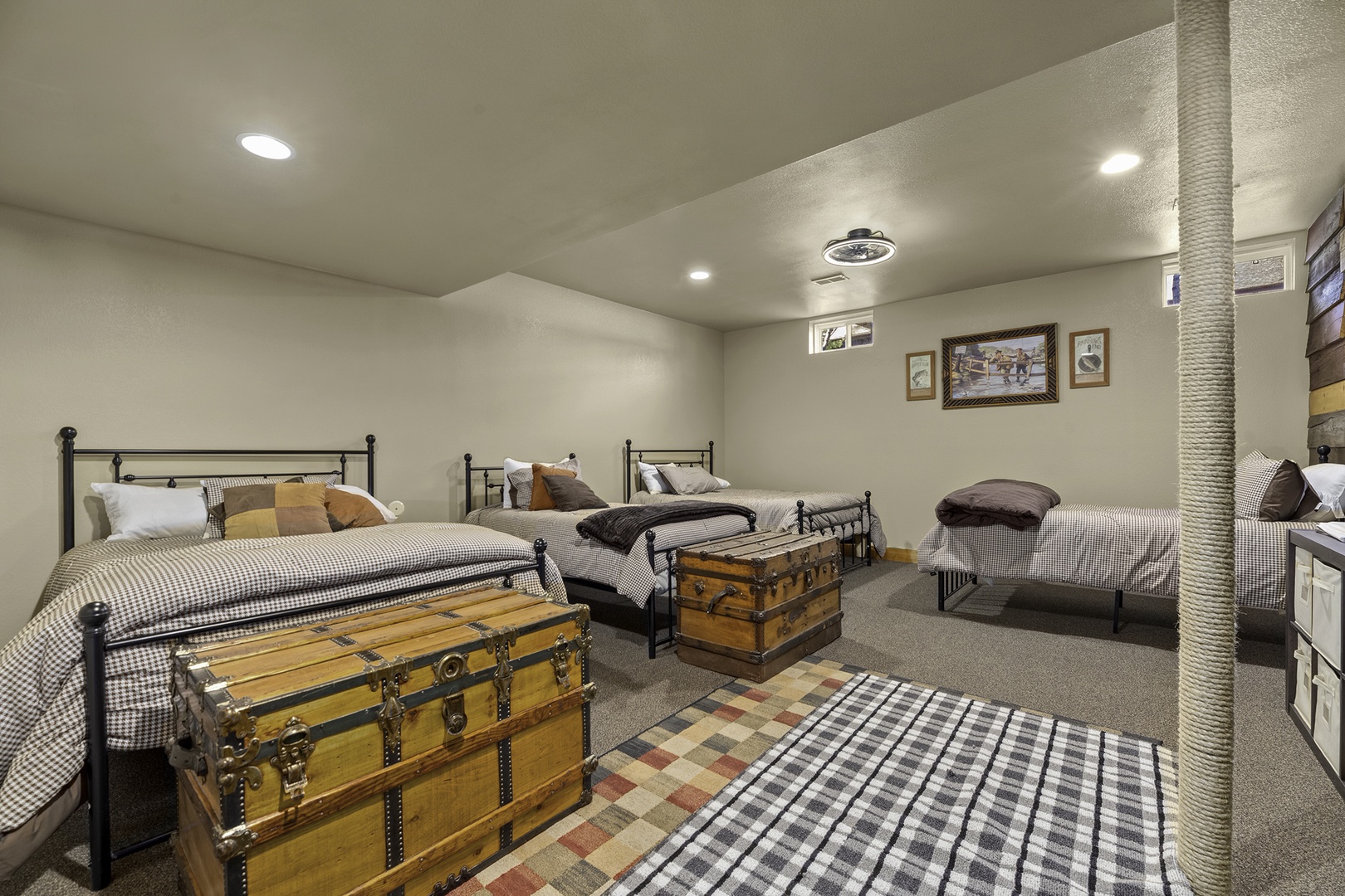 Gather your crew in this spacious bunk room, complete with vintage trunks and cozy bedding for a comfortable night's sleep after your adventures.