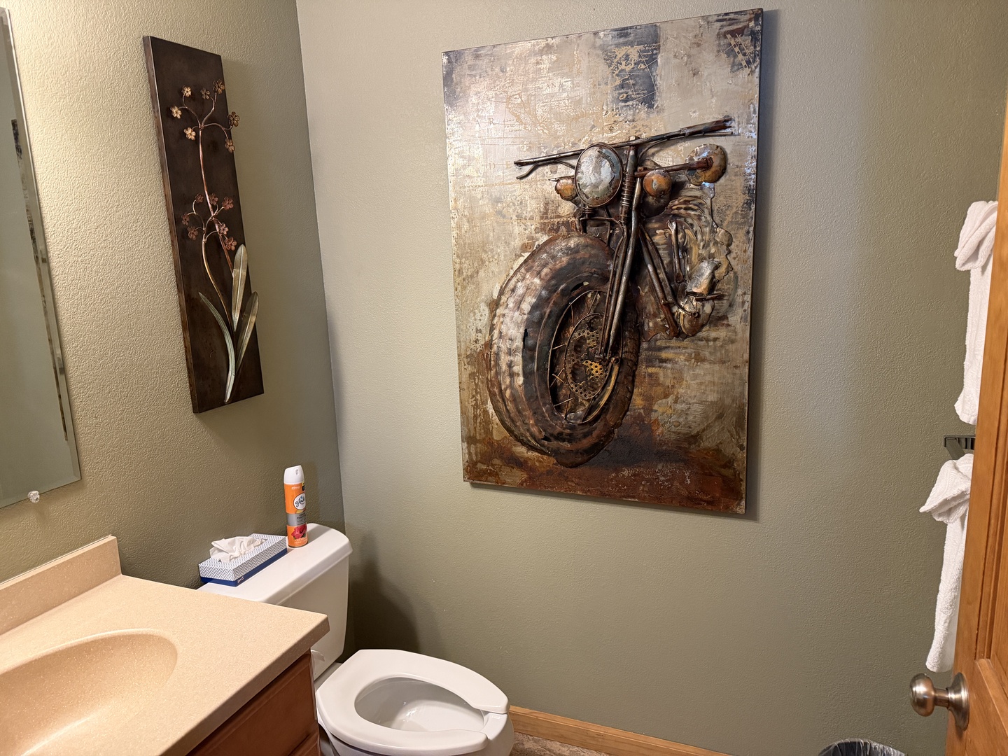 Your private bathroom features modern fixtures, fresh towels, and thoughtful décor that adds character to this comfortable space during your stay.