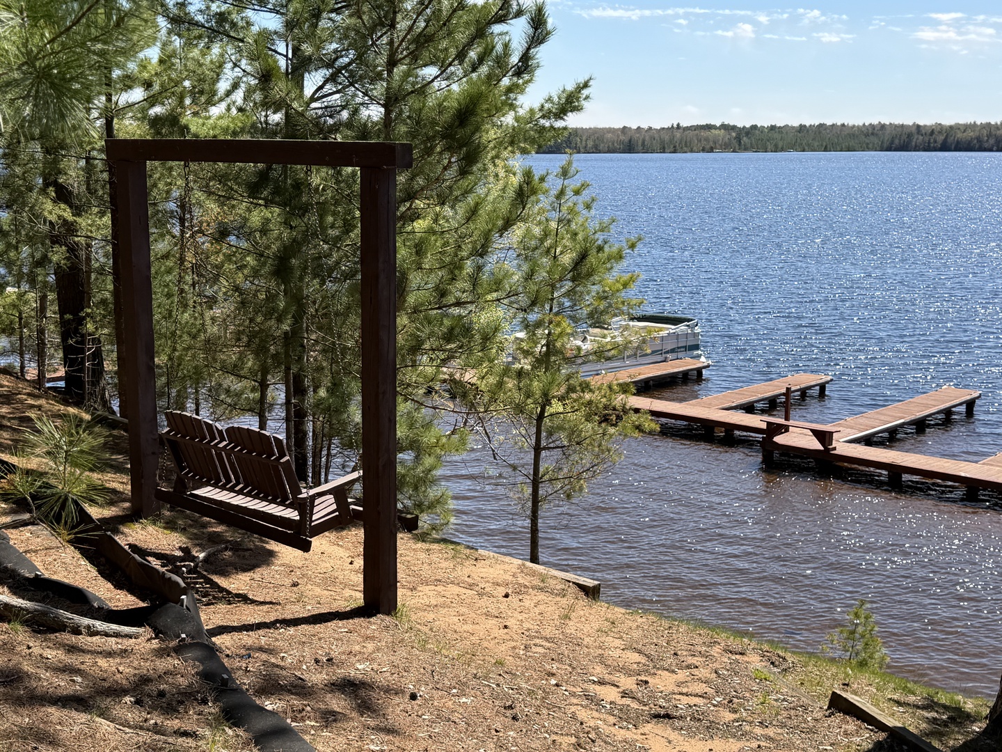 Unwind on your private swing while gazing at the tranquil lake and dock. Perfect spot to sip morning coffee or watch the sun sparkle on the water.