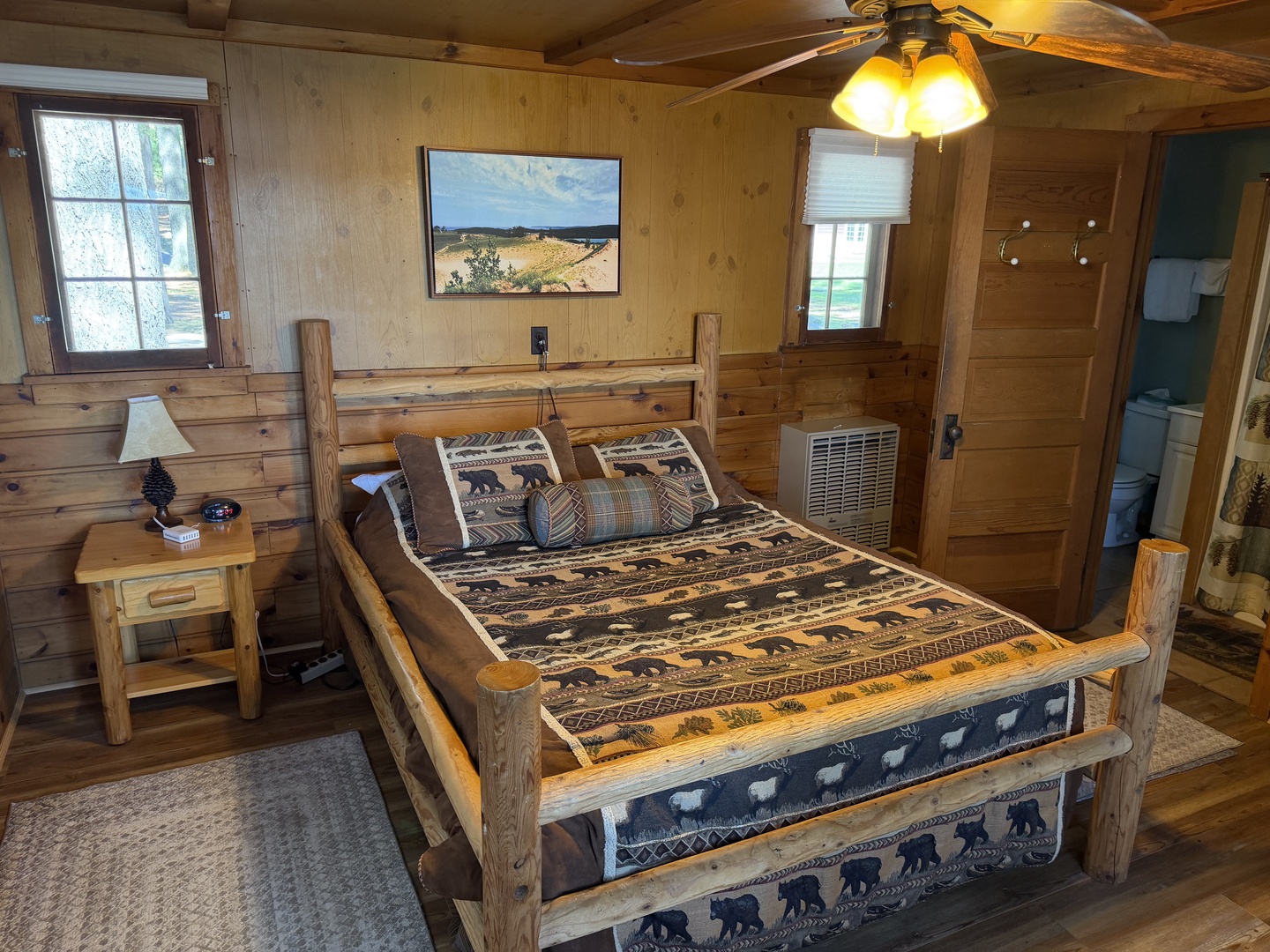 Step into your cozy cabin retreat with rustic log furnishings and vaulted ceilings. Your handcrafted timber bed invites restful sleep, while natural wood walls create warmth and charm throughout your private getaway.