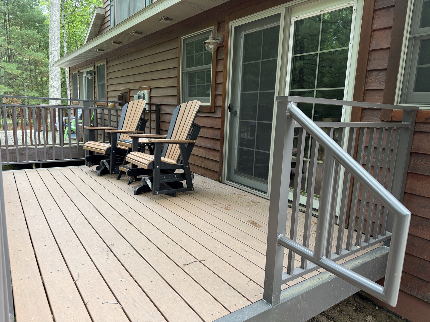 Your private deck invites you to unwind in comfortable Adirondack chairs, surrounded by peaceful forest views and fresh mountain air—perfect for morning coffee or starlit evenings.