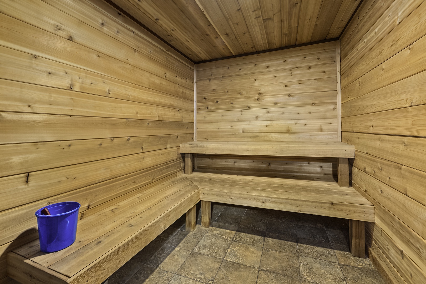 Feel the stress melt away in this private sauna, with warm wooden benches and tranquil surroundings designed for deep relaxation.