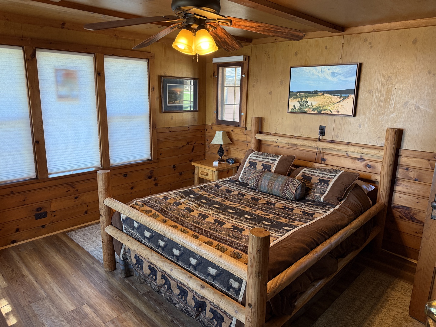 Rustic charm meets comfort in your private retreat. Sink into a handcrafted log bed beneath warm wooden beams, with sunlight streaming through cabin windows. Unwind beneath the gentle ceiling fan after a day of adventure.