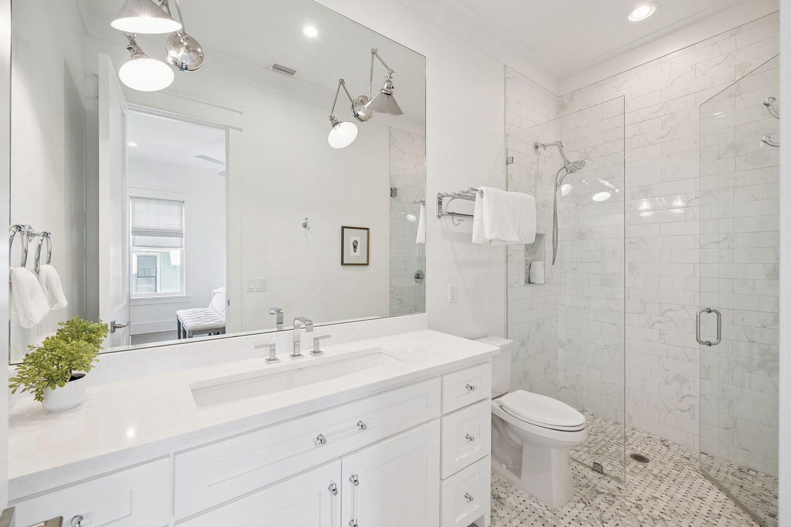 Indulge in your private spa-like retreat with marble surfaces, rainfall shower, and elegant lighting creating the perfect sanctuary.