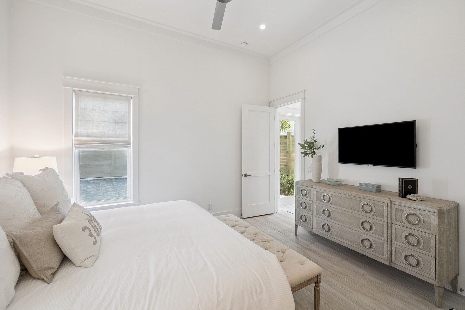 Rest peacefully in your bright, airy bedroom with plush bedding, elegant furnishings, and a smart TV for cozy evenings.