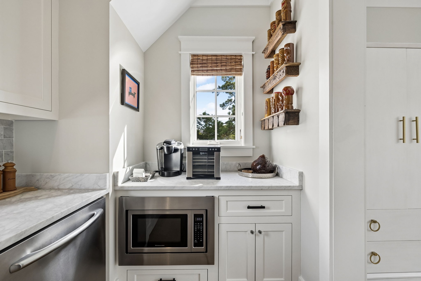 Your own coffee bar awaits with everything you need for a perfect morning ritual. Sunlight pours through the window as you brew your first cup in this charming nook.