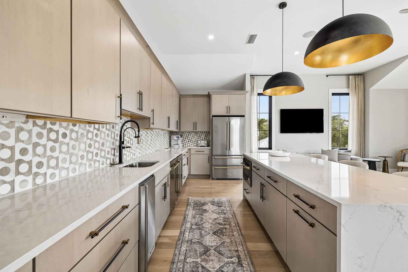 Step into your dream kitchen with gleaming marble counters, sleek cabinetry, and stylish gold-accented lighting. Cook with ease using top-tier stainless steel appliances while soaking in natural light.