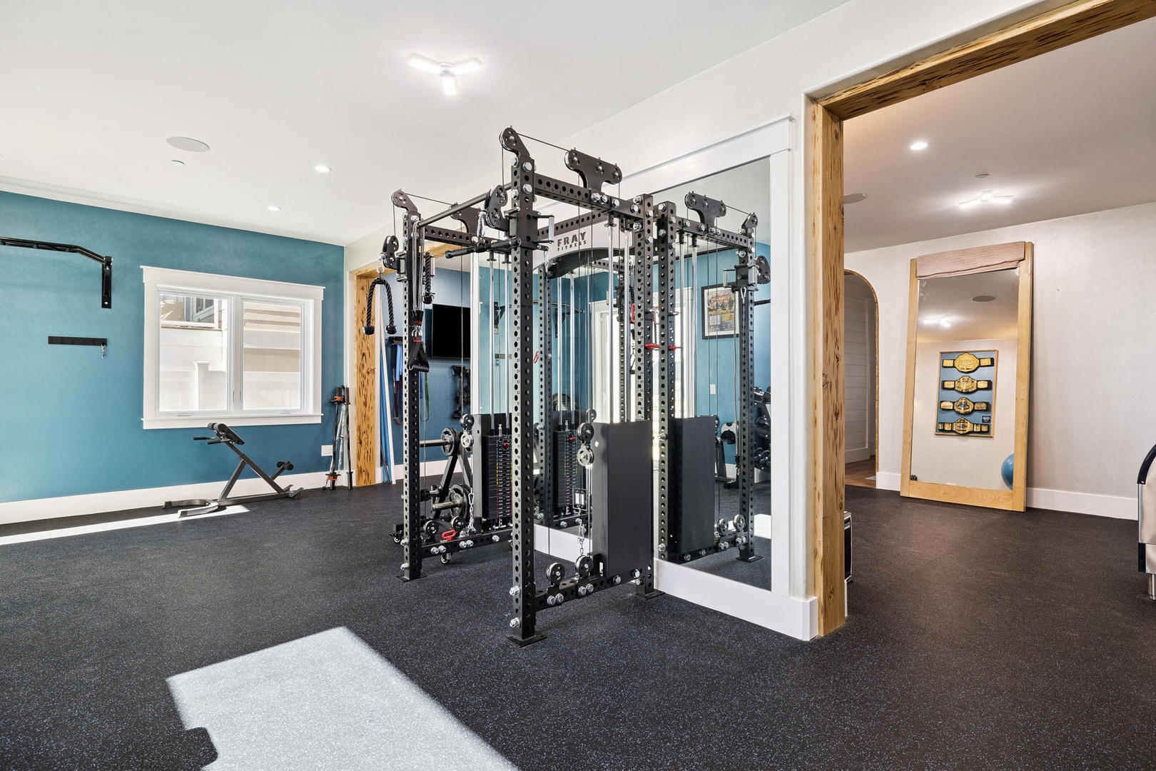 Your private fitness sanctuary awaits with professional-grade equipment and mirrored walls for perfecting your form during energizing workouts.