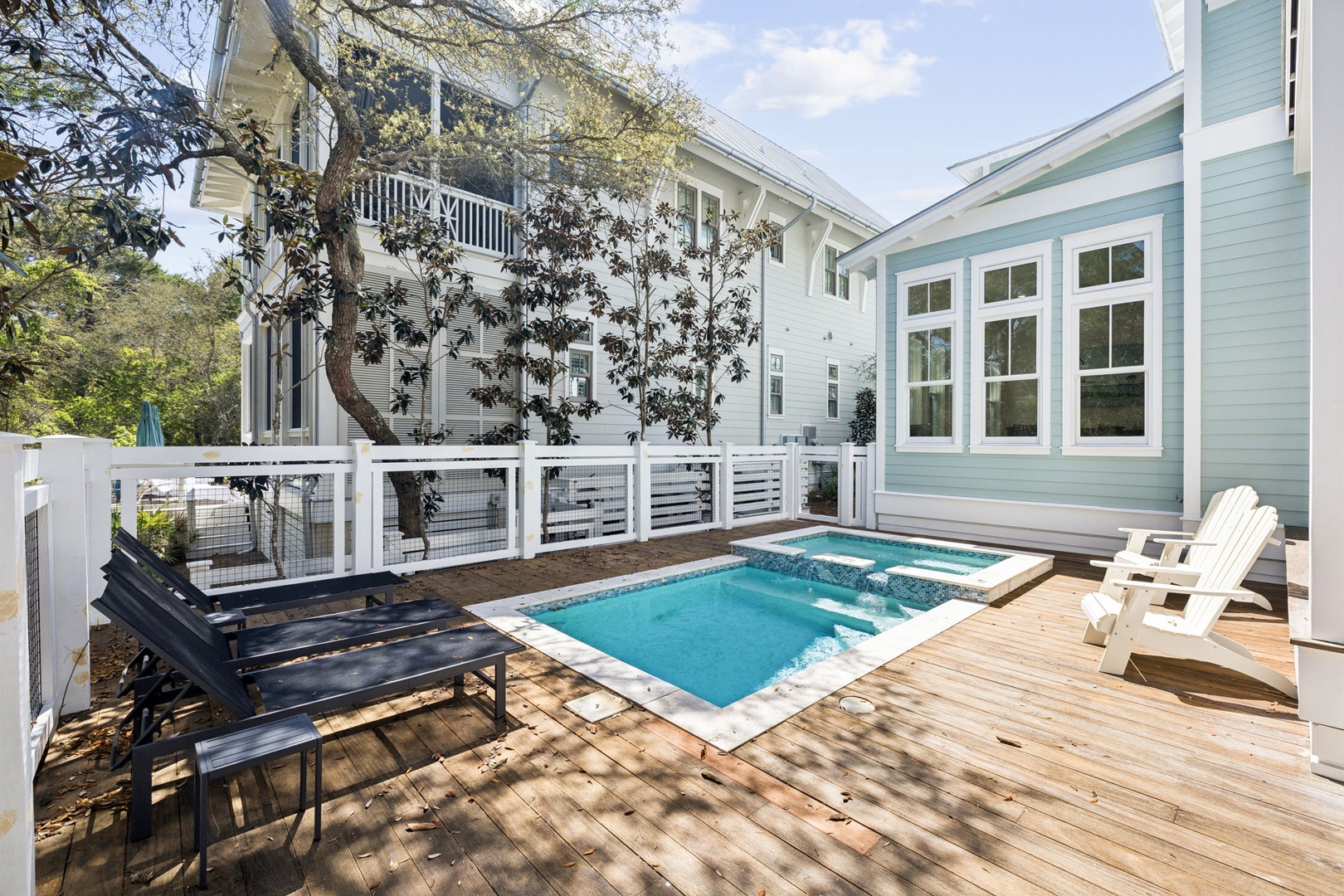 Your private oasis awaits with a sparkling pool and hot tub surrounded by deck seating for ultimate relaxation.