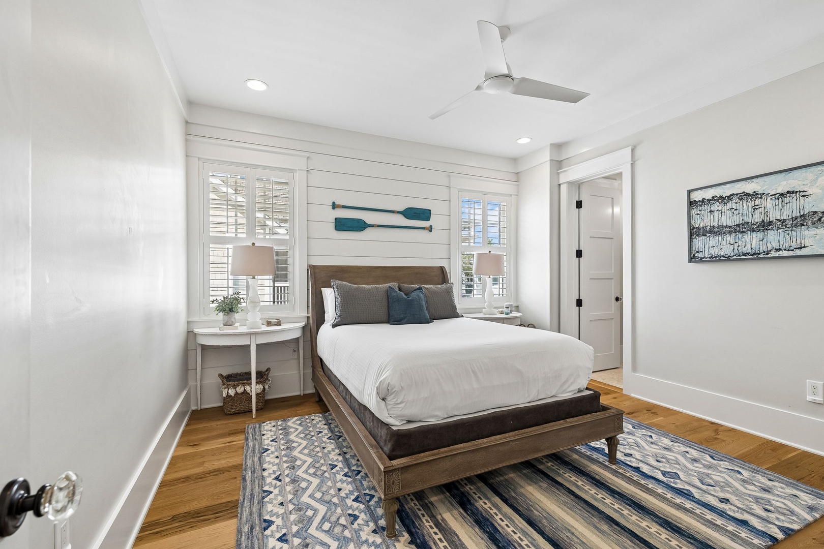 Unwind in your coastal-inspired retreat, complete with crisp white linens, natural wood accents, and serene blues that invite you to settle in and stay awhile.