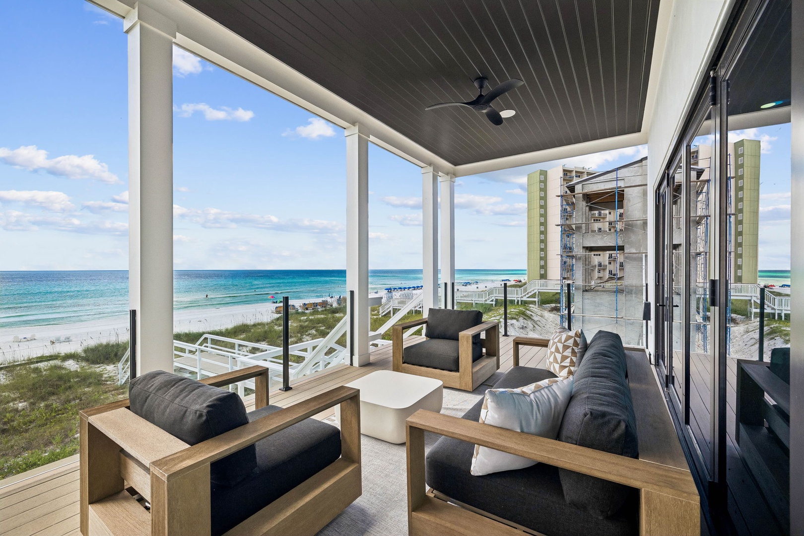 Your private covered terrace opens to breathtaking ocean views and white sand just steps away. Sink into plush seating, feel the coastal breeze, and let the sound of waves set your vacation rhythm.