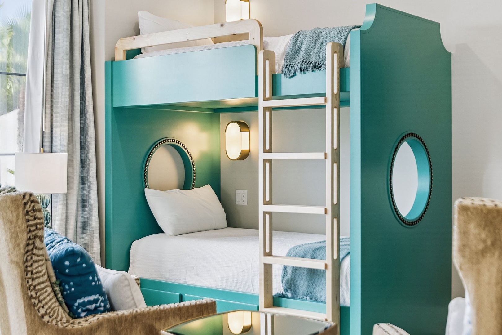 Your kids will love the nautical-themed bunk beds with cozy reading lights and playful porthole windows—perfect for bedtime stories and sweet dreams.