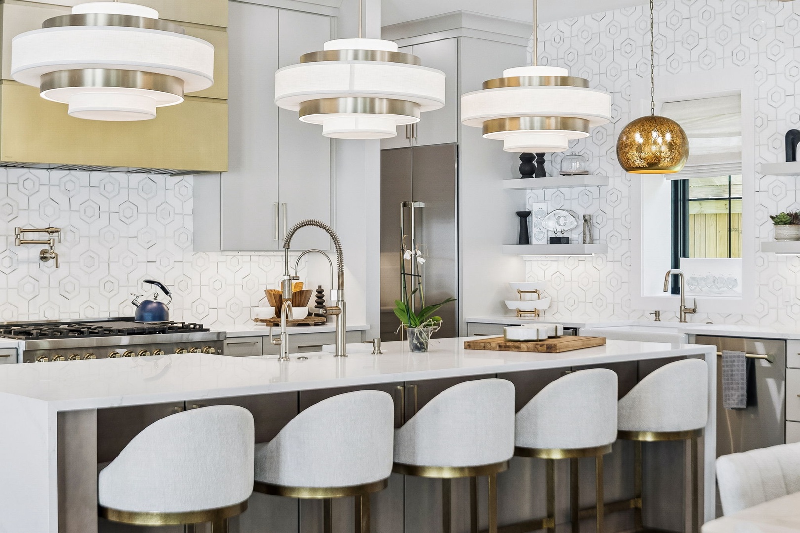 Gather around this stunning kitchen island with plush seating and elegant pendant lighting—your perfect spot to prep meals, share stories, or sip morning coffee in style.