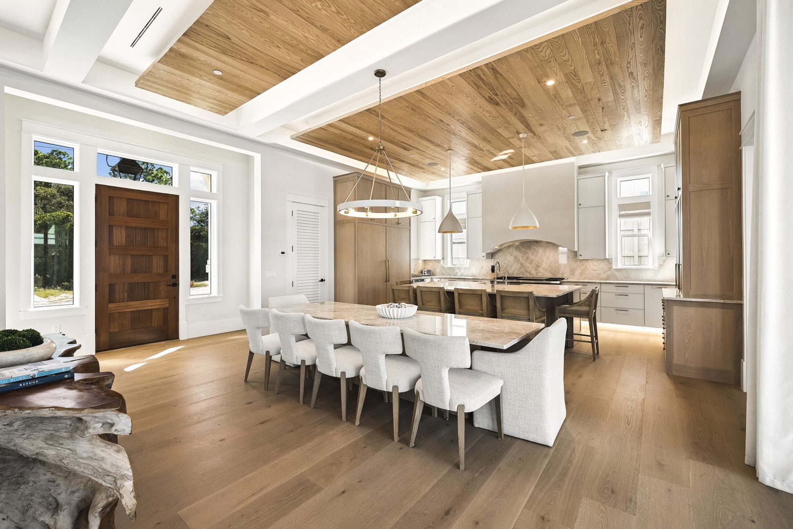 Step into this sun-drenched, open-concept space where soaring wood ceilings and elegant dining meet gourmet cooking. Natural light pours in, inviting you to gather, cook, and savor every moment together.