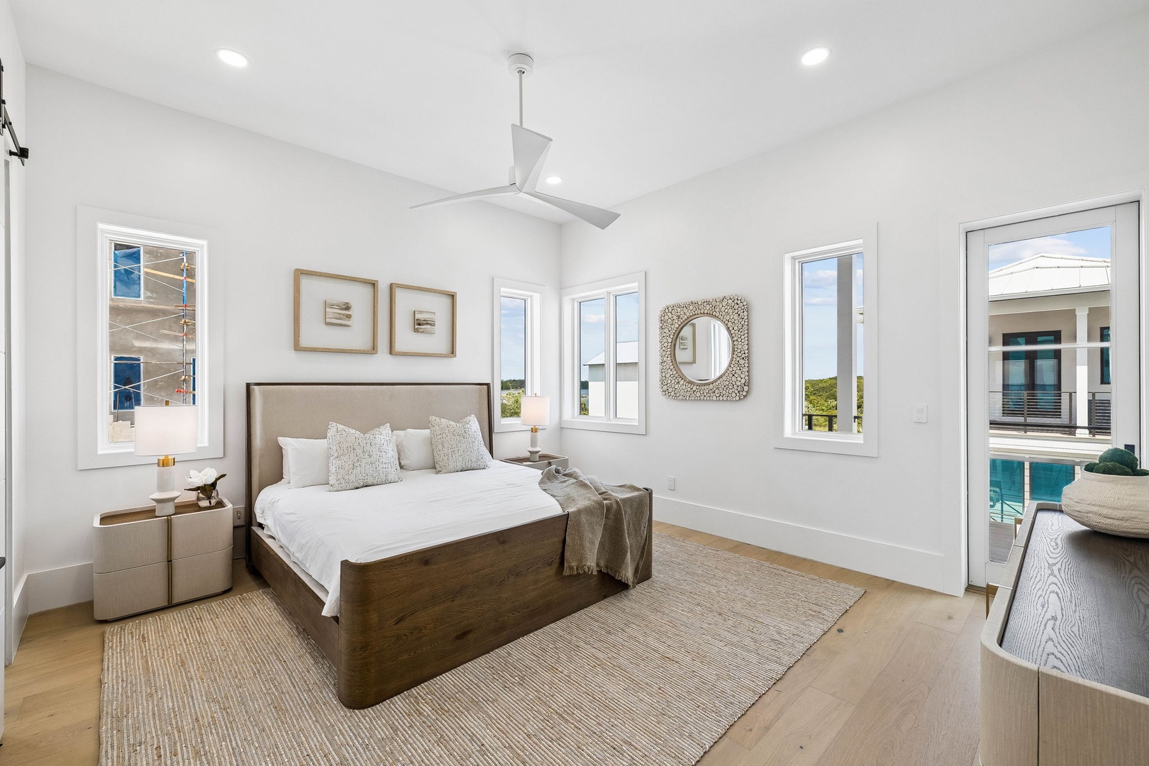Slip into your peaceful retreat where natural light pours through multiple windows and the ceiling fan keeps you cool. Step onto your private balcony overlooking the sparkling pool—your perfect morning coffee spot.