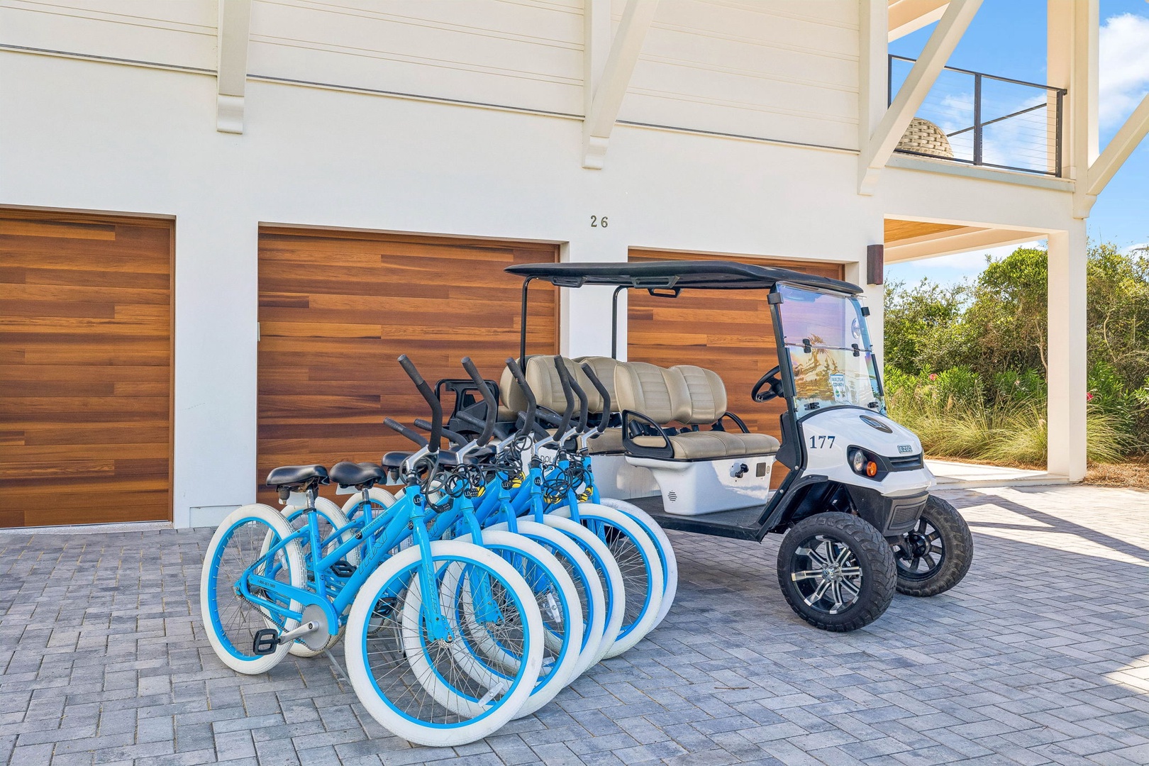 Complimentary bikes and a golf cart await at your villa entrance, ready to help you explore the surrounding community at your leisure.