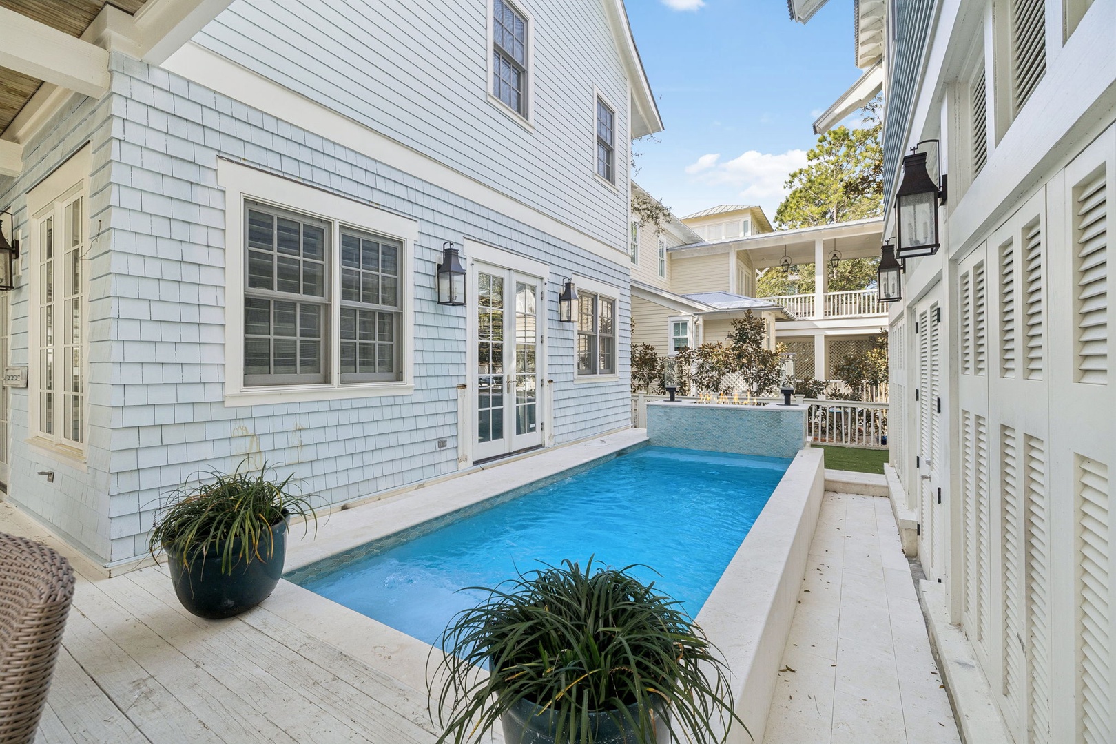 Slip into your private oasis where crystal-clear waters await between charming coastal cottages, creating the perfect retreat for relaxation and renewal.