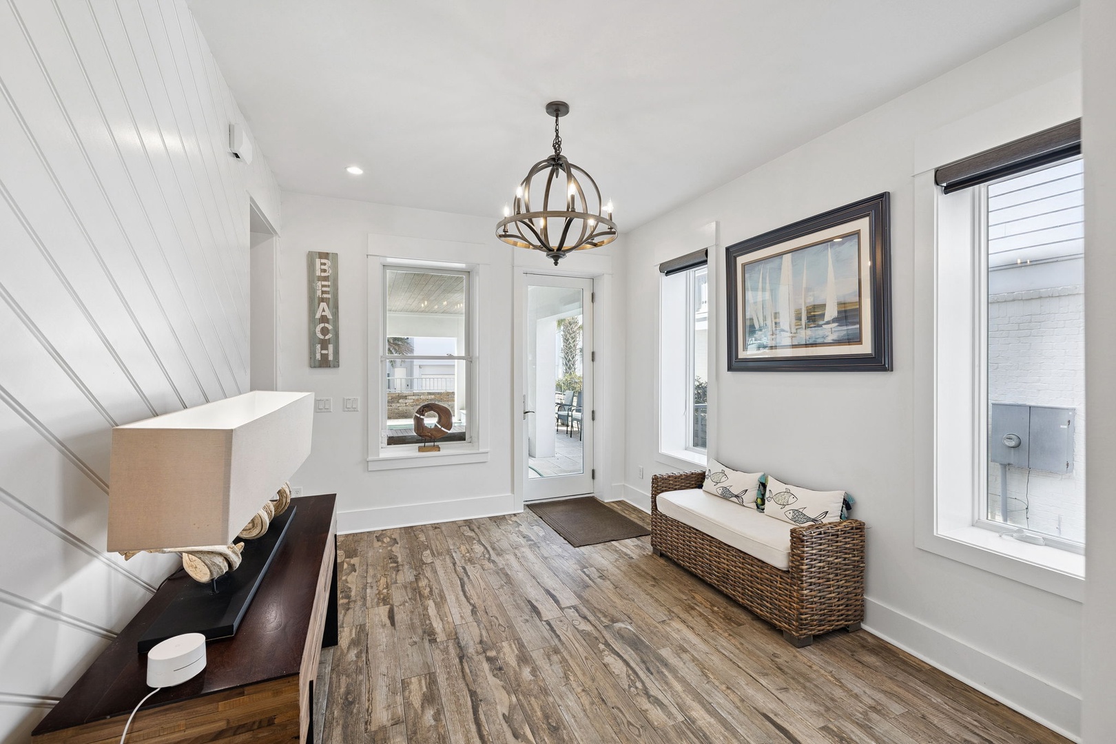 Step into your bright, welcoming entryway featuring rustic wood floors, cozy seating, and elegant lighting that sets the perfect tone for your stay.