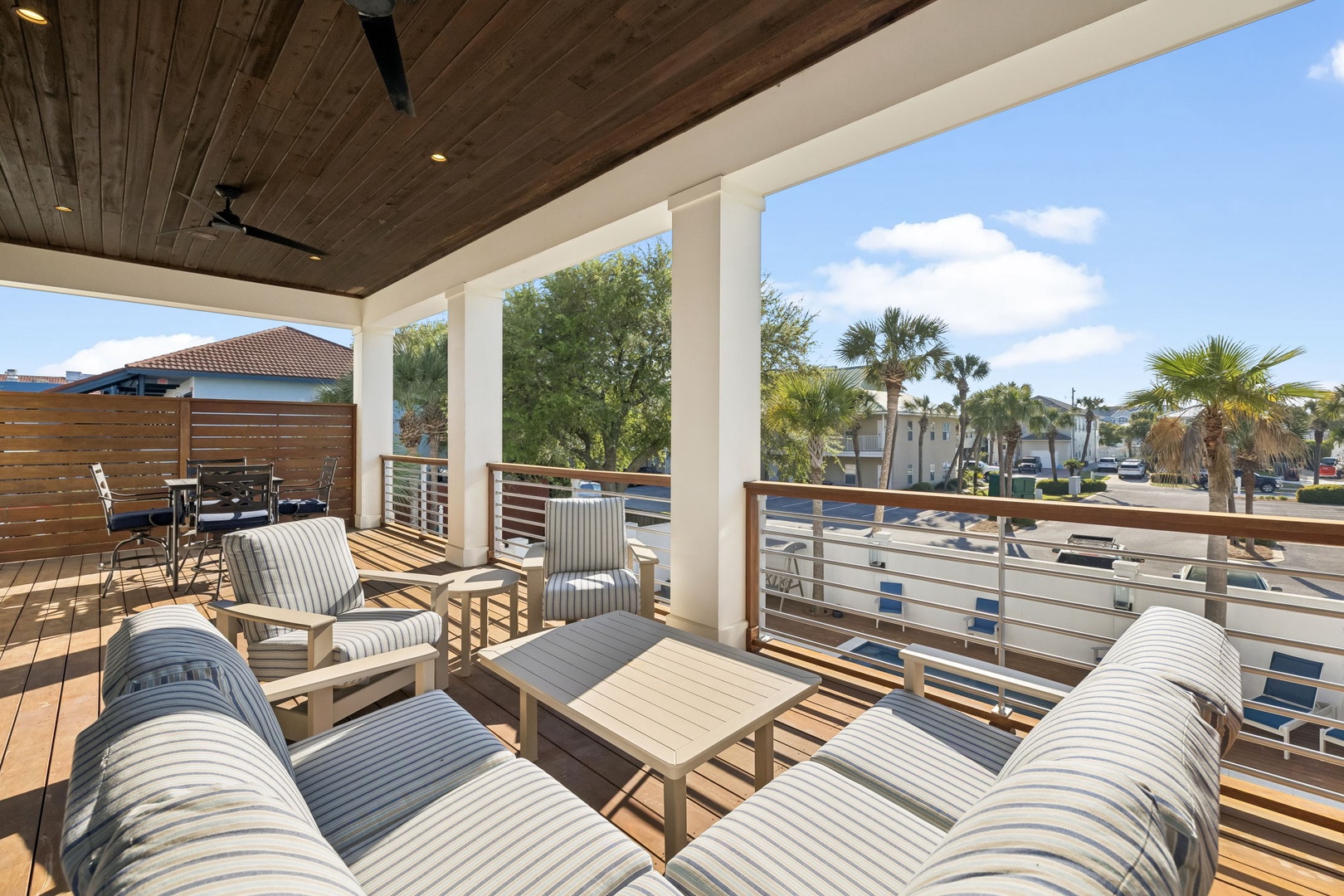 Relax in your private covered terrace with stylish seating overlooking tropical palms and marina views.