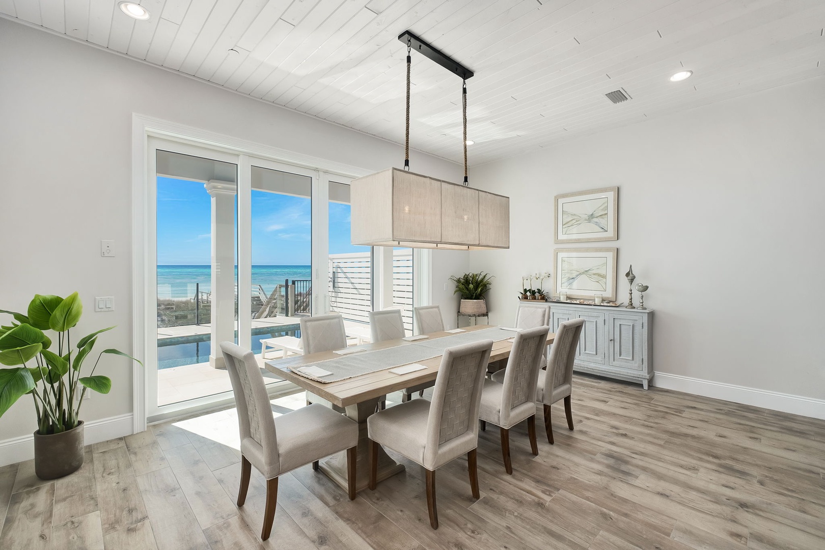 Gather for memorable meals with stunning ocean views through these expansive windows that perfectly frame your beachside retreat.