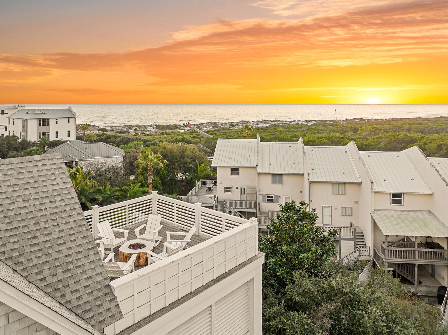 Watch breathtaking sunsets from your private rooftop terrace, complete with cozy seating and ocean views stretching to the horizon.