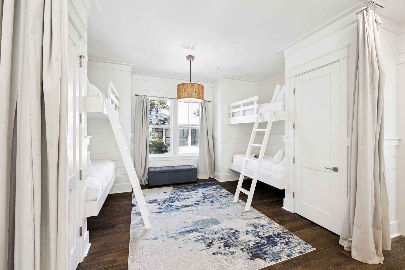 Your group will love this bright bunk room with built-in beds and privacy curtains for restful sleep.