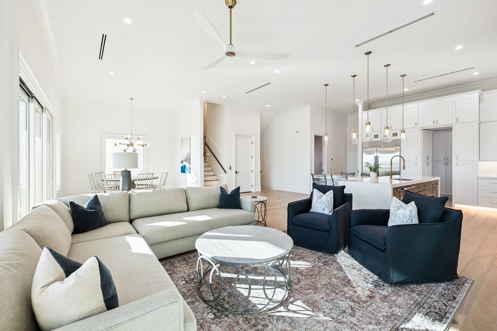 Step into your stunning open-concept haven where natural light floods through expansive windows, illuminating plush seating perfect for unwinding after exploring.