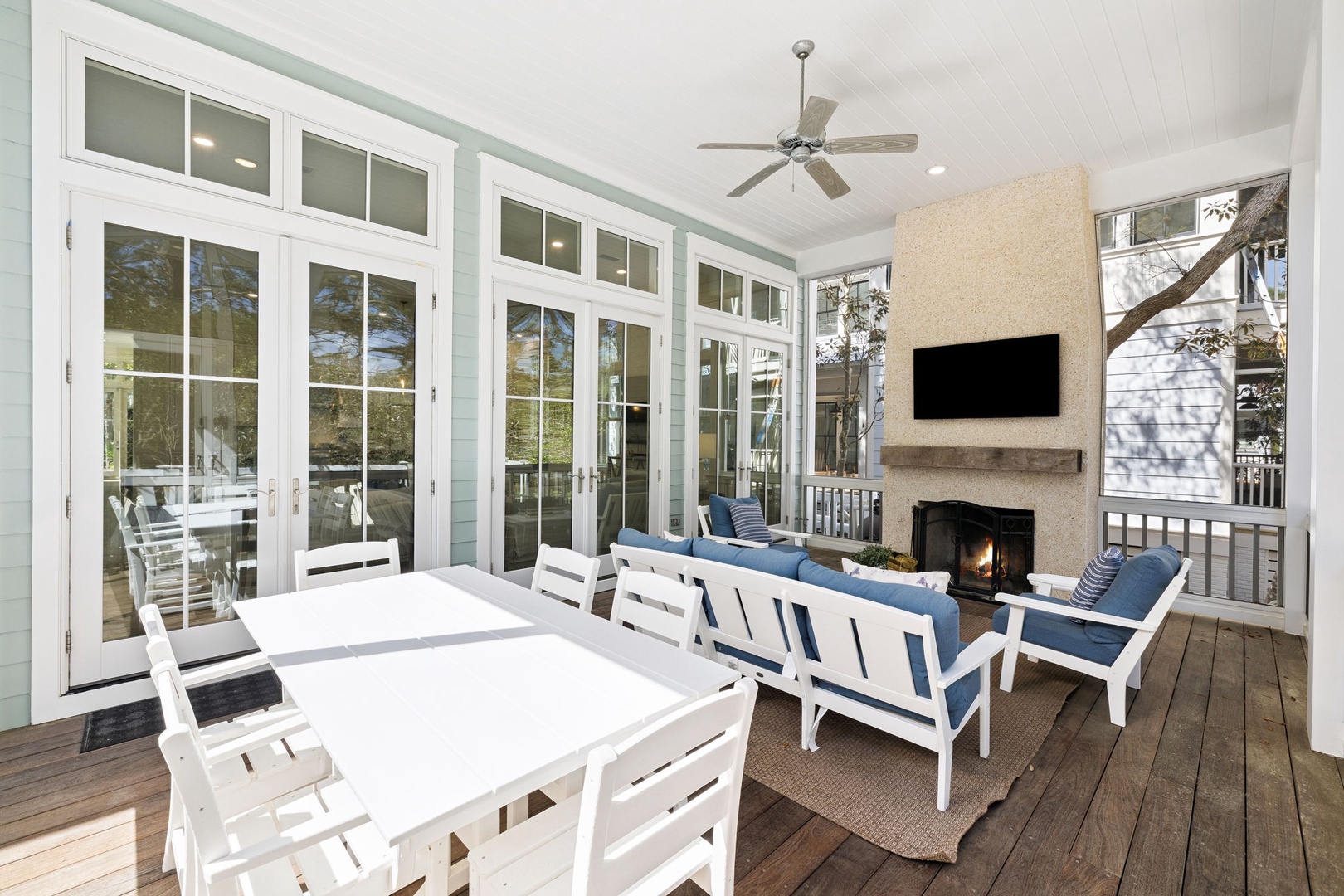 You'll love gathering around your cozy fireplace while enjoying meals at your private dining table on this screened porch.