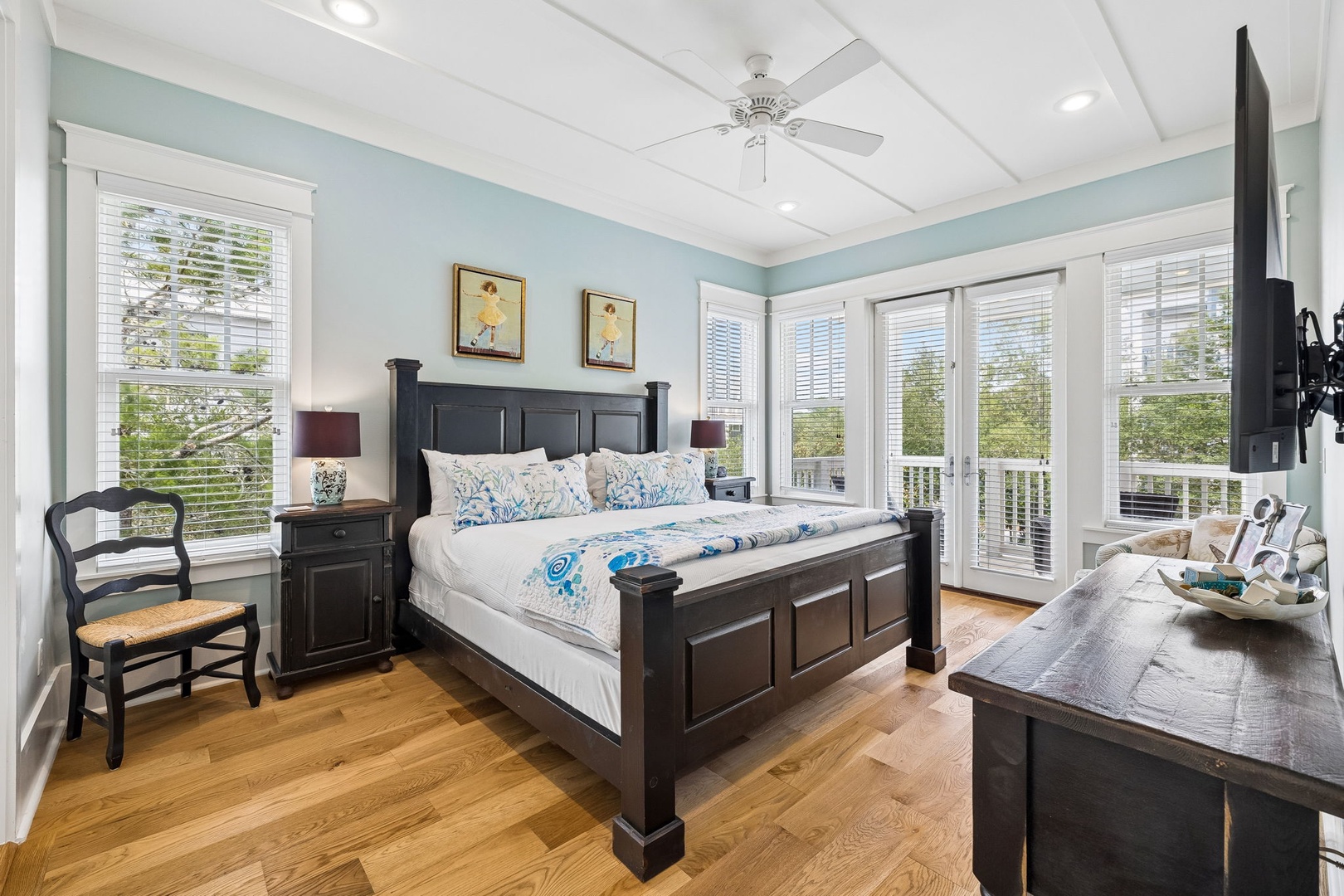 Wake up to soft blue walls and natural light pouring through plantation shutters. Your plush bed opens to a private balcony where greenery and fresh air await each morning.