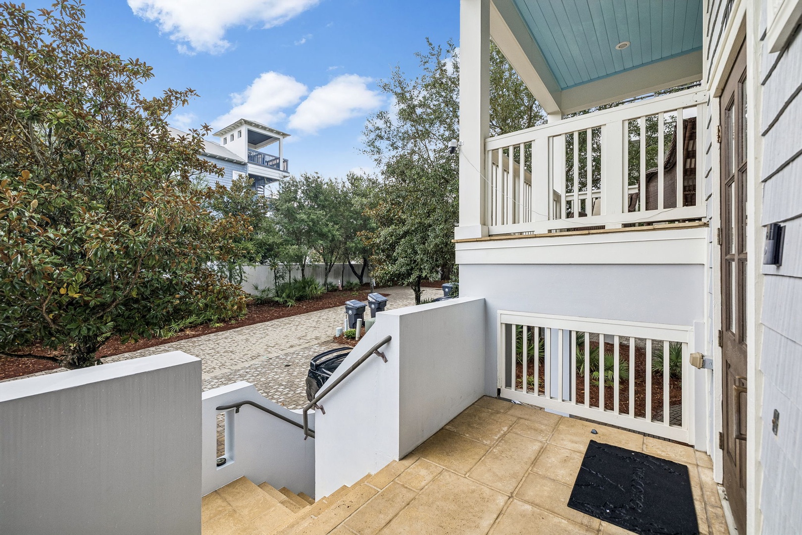 Your private entrance opens to tranquil green surroundings, offering a peaceful welcome home after your beach adventures.