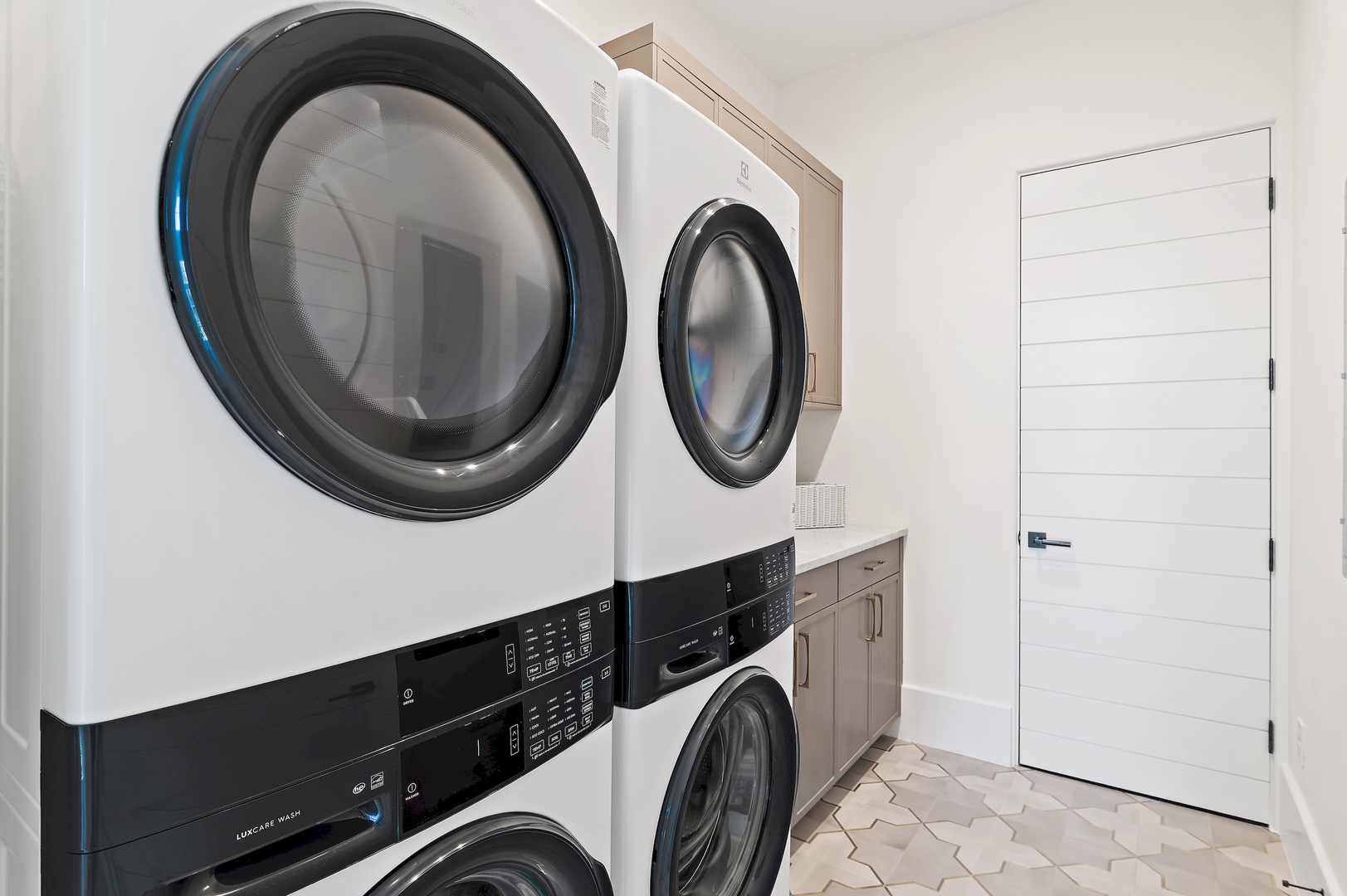 Your dedicated laundry room features modern stacked washers and dryers with stylish cabinetry, making it effortless to stay refreshed throughout your stay.