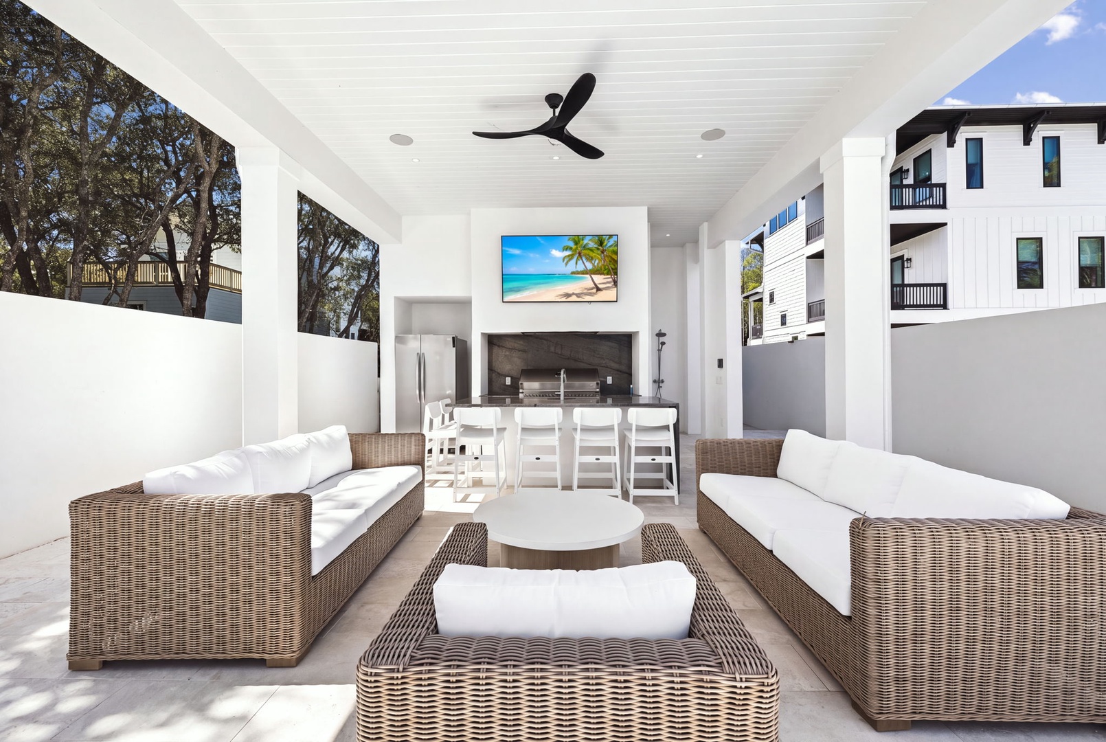 Gather in your covered outdoor living space with plush wicker seating, a dedicated BBQ area, and dining for eight—perfect for effortless entertaining under the sun or stars.