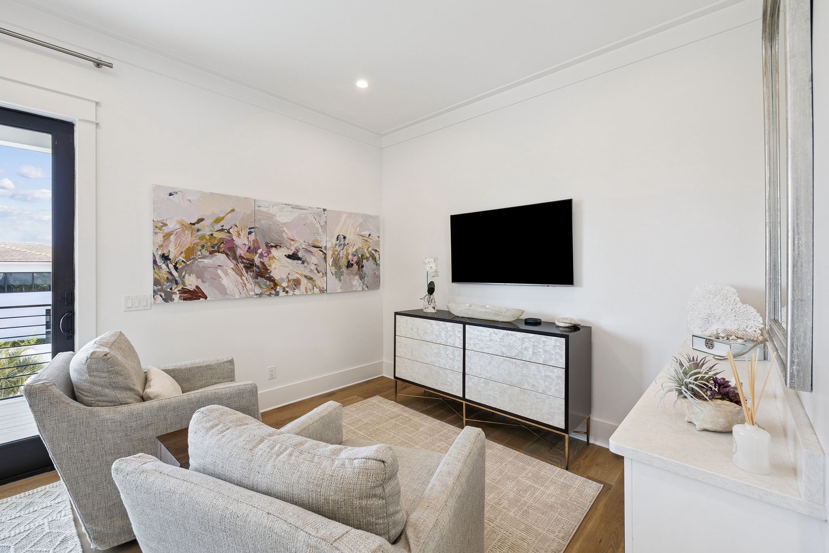 Unwind in your stylish living space with comfortable seating and modern entertainment setup for relaxing evenings.