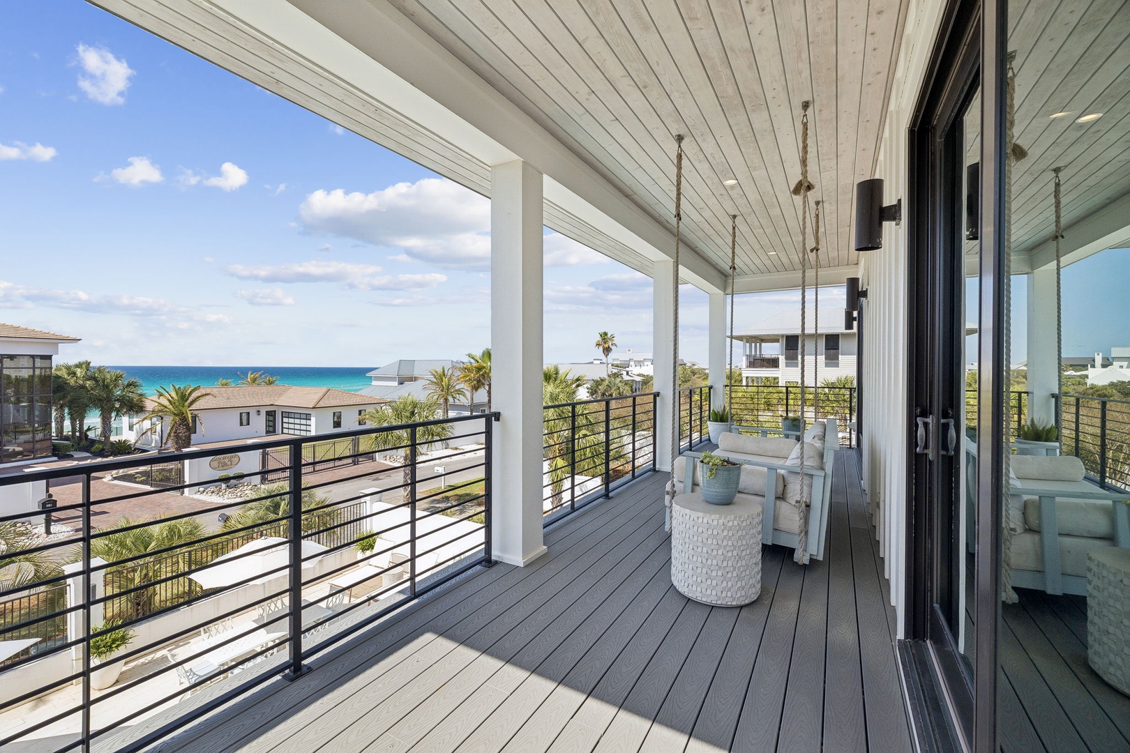 Relax on your private covered balcony with stunning ocean views and comfortable seating, perfect for morning coffee or sunset cocktails.